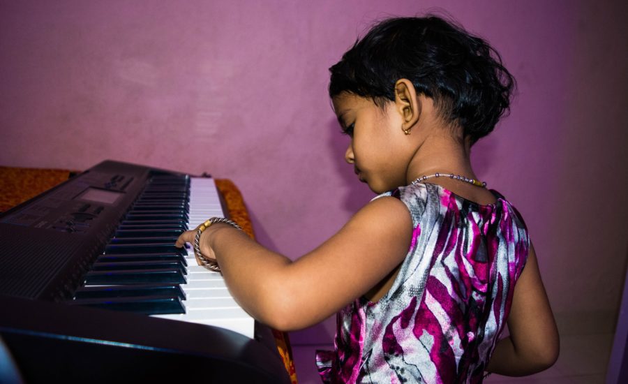 girl playing piano